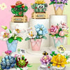 A set of floral bouquet building blocks featuring various succulents and flowers in pink, green, and purple colors.