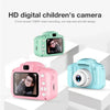 A pink and light blue digital children's camera with a 2 inch screen shown in various angles.