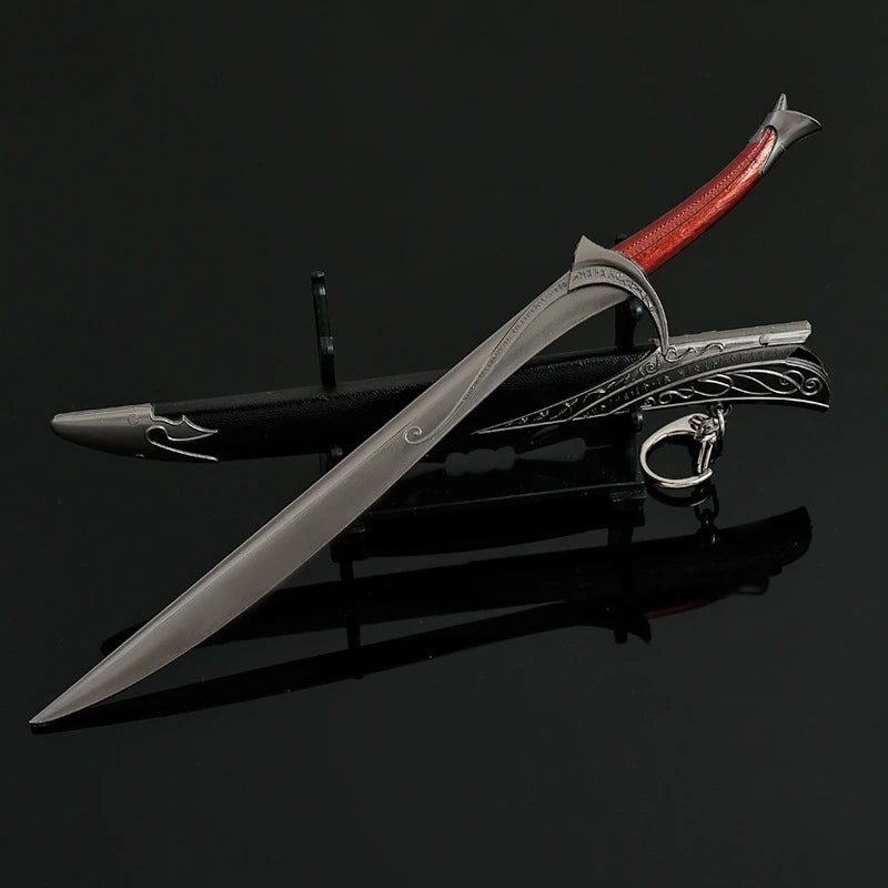 A detailed replica of Orcrist sword, a metal model of Thorin Oakenshield, featuring a silver blade and red hilt.