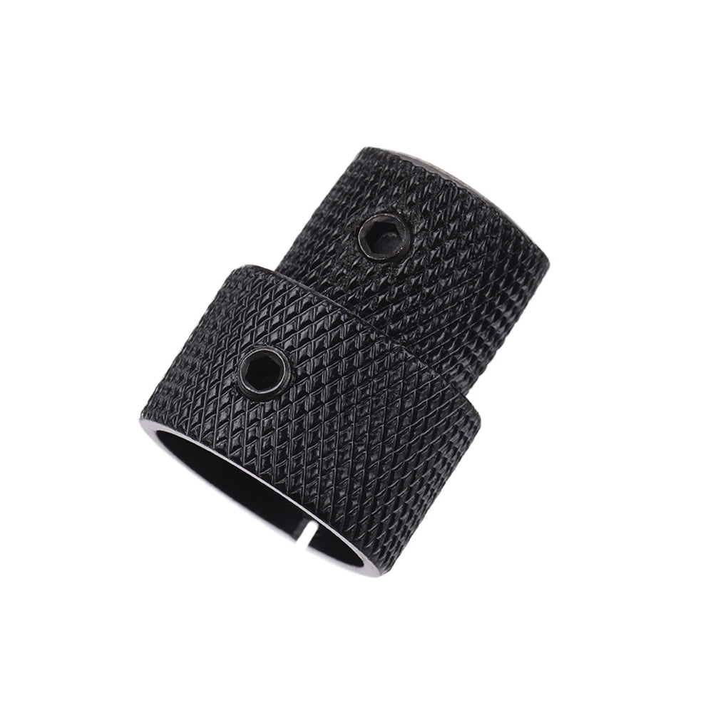 A pair of black dual concentric stacked control knobs for electric guitar and bass.