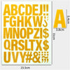 A sheet of DIY iron-on heat transfer patches showing the alphabet and symbols in yellow color.