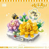 A yellow floral bouquet building block set featuring various flower shapes and greenery.