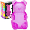 A pink gummy bear shaped bear squeeze toy with ears and a round body, packaged in a box.