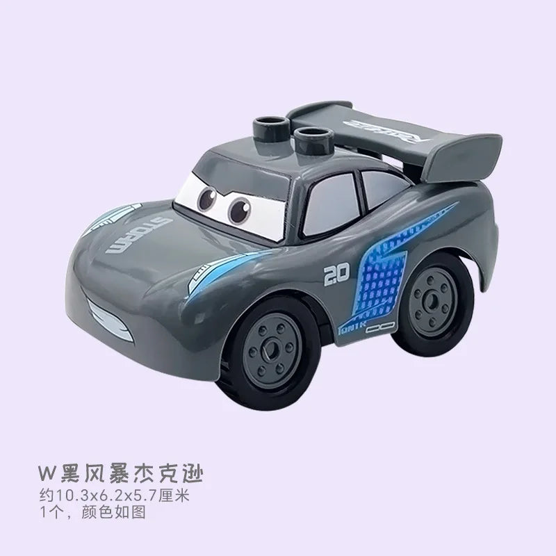 A gray die-cast toy car resembling a sports car with blue accents and a trailer, part of a city traffic building block set.