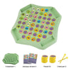 A green flip chessboard game with numerous dinosaur stickers and chess pieces.