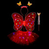 A red LED butterfly costume set for girls featuring glowing wings, a skirt, and a wand.