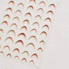 A sheet of gold-colored nail art stickers featuring various curved shapes for cosmetic application.