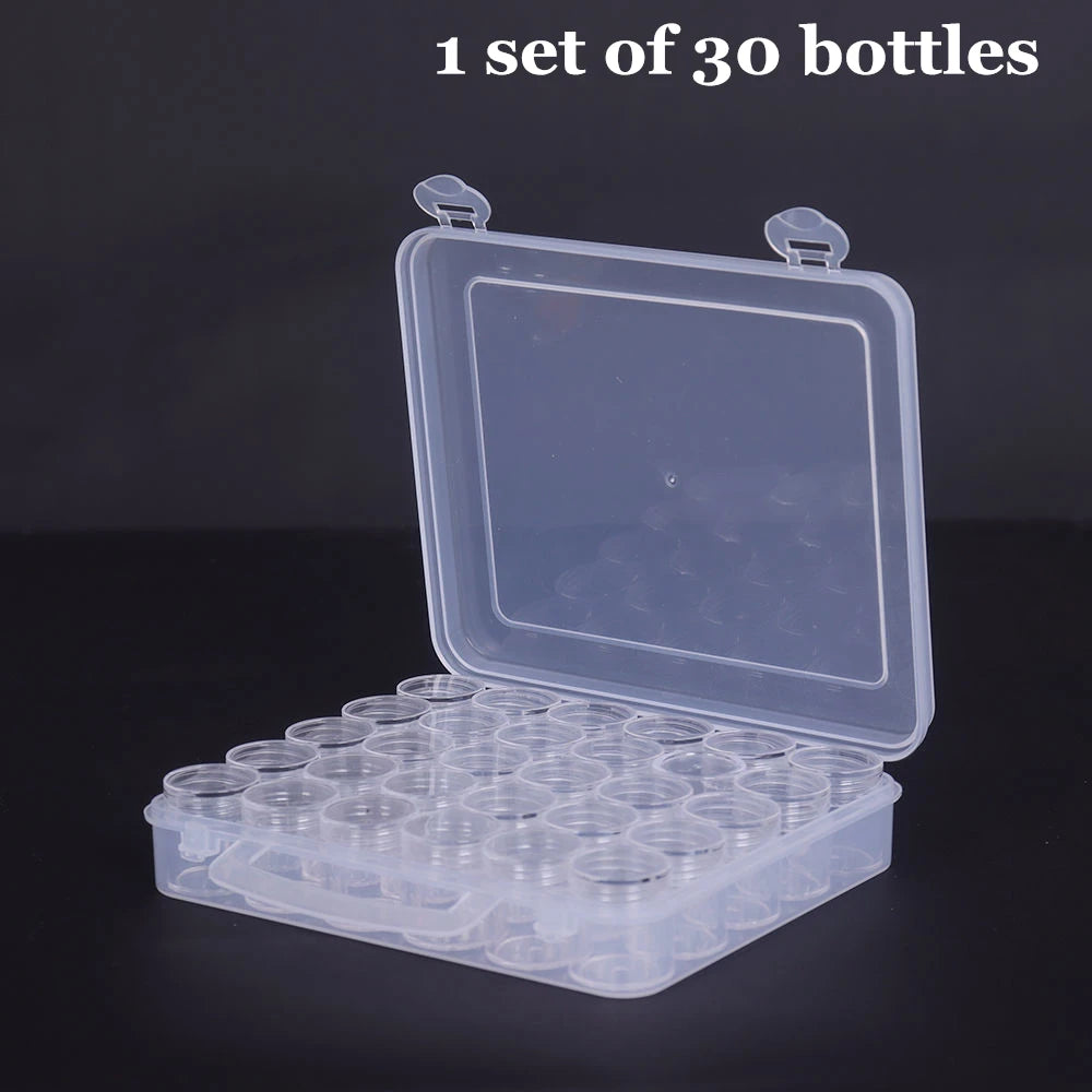 A clear plastic storage box containing 30 round bottles with labels, shown open on a dark surface.