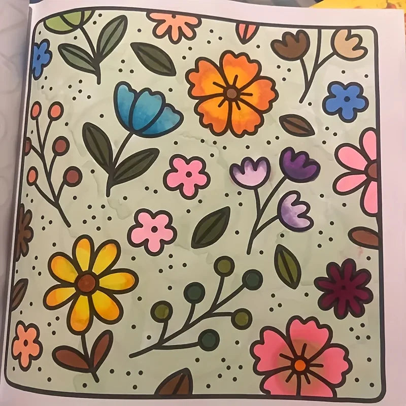 A page from a coloring book featuring various colorful floral and leaf patterns on a light green background.