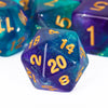 A close-up of a translucent purple polyhedral die with gold glitter numbers resting on a white surface.