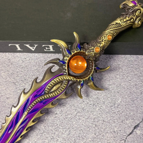 A close-up of an 11-inch metal Naraka Bladepoint Katana replica with purple and gold detailing and an orange gem.