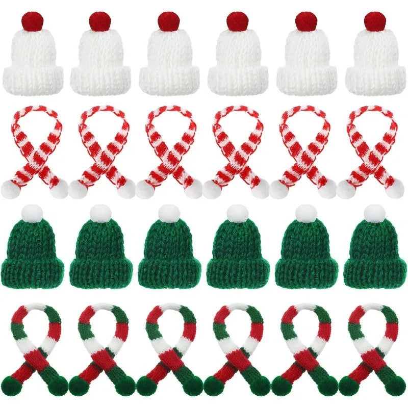 A set of mini knitted hat and scarf accessories for dolls featuring red and white patterns.