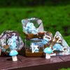 A set of translucent polyhedral dice shaped like mushrooms and featuring blue cloud designs on a wooden surface.