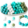 A collection of soft food-grade silicone beads in various shades of blue, white, and green.