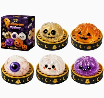 A set of Halloween-themed squishy stress relief toys including a pumpkin, a ghost, and a purple slime.