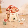 A wooden mushroom castle stacking toy puzzle for kids featuring various pieces and a climbing structure.