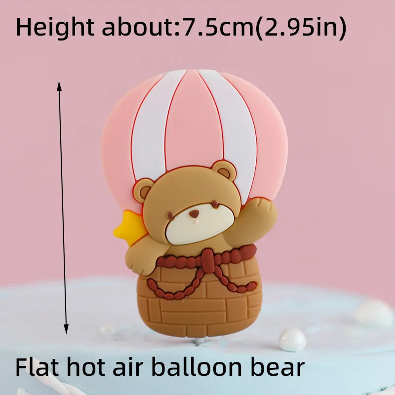 A flat hot air balloon bear cake topper in brown and yellow colors