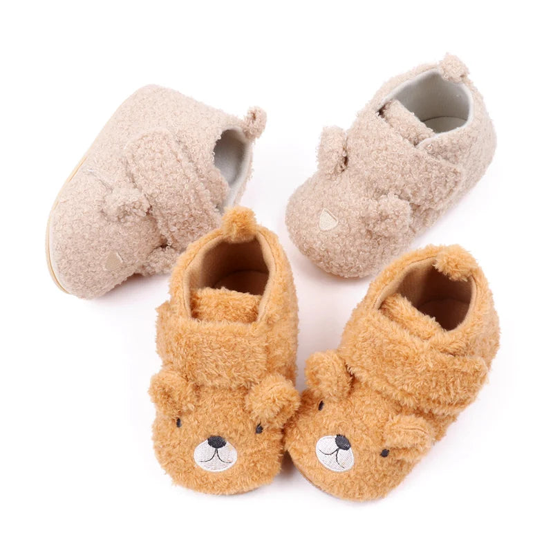 Pair of cute bear design baby prewalker shoes with soft anti-slip soles in beige and brown tones.