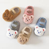 A collection of five adorable cartoon bear baby booties in various soft colors and textures.