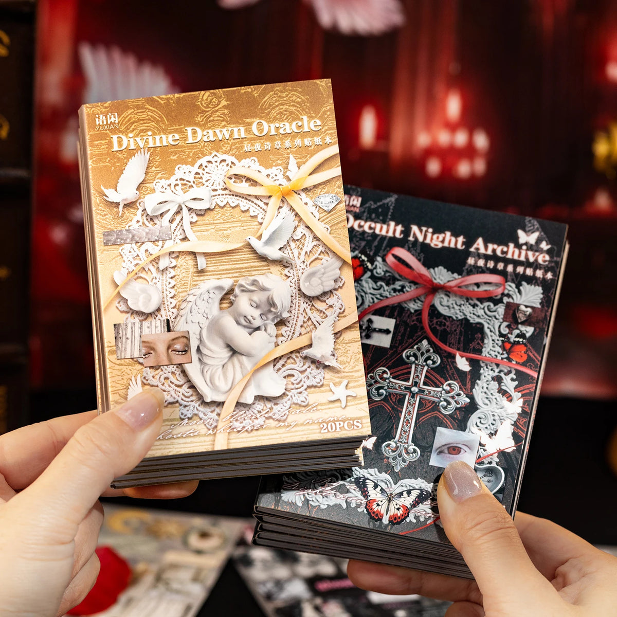 A hand holds a deck of Divine Dawn Oracle tarot cards next to a stack of black cards, set against a dark background.