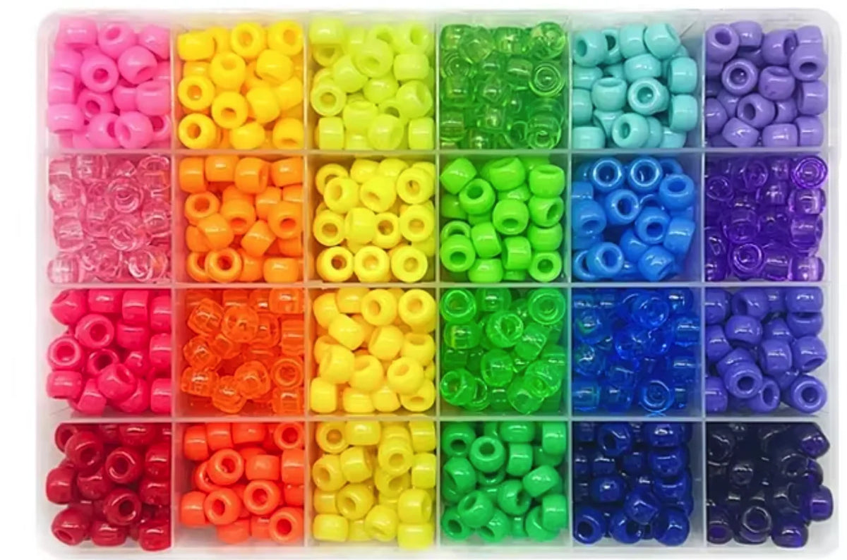 A variety of colorful pony beads and letter beads packaged in a clear plastic tray for DIY bracelet making.