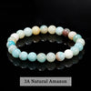 A bracelet made of small, round beads in various shades of pink and blue quartz.