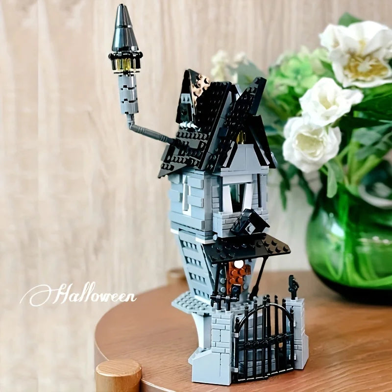 A detailed building block set of a haunted house featuring a spire and dark gray and black architectural elements.
