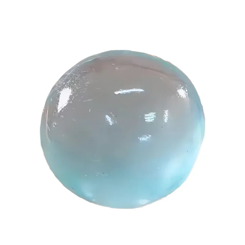 A translucent, spherical pink mochi squishy stress relief toy.