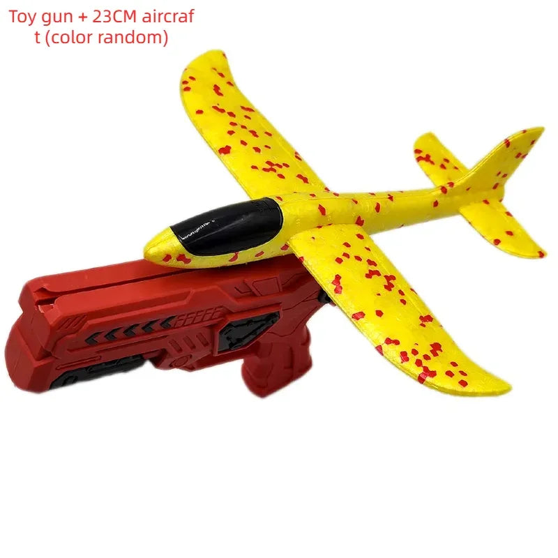 Avion jouet aile en forme de glisseur jaune et rouge avec lanceur rouge.
