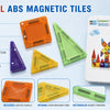 Colorful ABS magnetic tiles in various shapes and colors displayed alongside a compact travel set box.