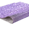 Purple sparkling rhinestone adhesive tape rolled up for DIY crafts and decor