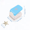 Light blue lever action embosser with a silver star design shown next to a floral star stamp.