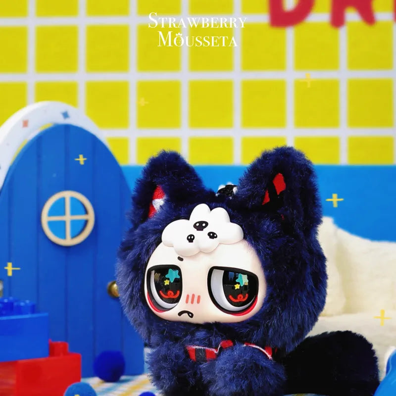 A fluffy dark blue creature with large eyes is featured against a yellow grid background.