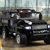 A black SWAT City Police truck diecast toy with lights and sounds driving on a dirt road.