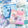 A collection of glitter die-cut sticker books and crafting materials featuring Japanese Showa style designs.