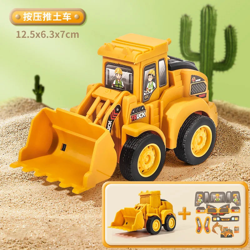 Un camion modèle en métal jaune de construction avec une pelle sur du sable.