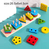 A collection of wooden geometric shapes and colored blocks used as a Montessori puzzle and sorter for toddlers.