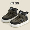 A pair of dark olive green and black high-top sneakers with velcro straps shown against a light background.