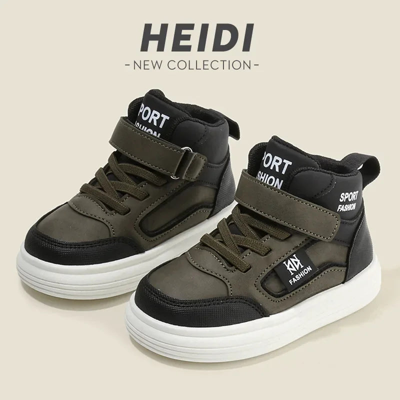 A pair of dark olive green and black high-top sneakers with velcro straps shown against a light background.