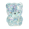 A clear silicone stress ball shaped like a bear covered in iridescent blue and purple water beads.