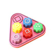 A pink plastic set of five colored gonggi stones for a traditional Korean game.