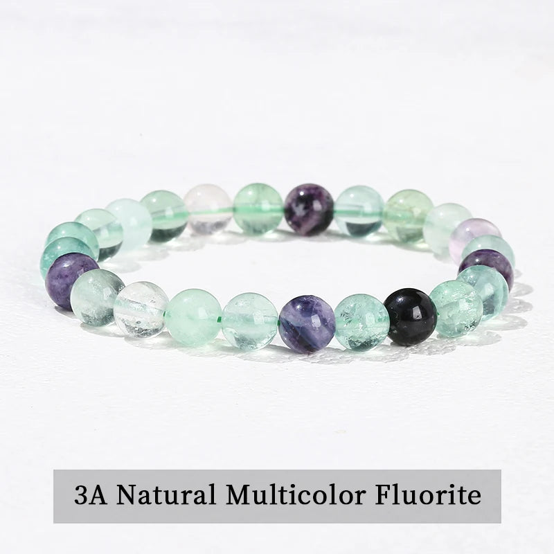 A bracelet made of 3A natural multicolor fluorite stones in various shades of green and purple.