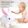 A baby is interacting with a white plush rabbit toy designed to move back and forth for children's growth journey.