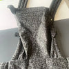 A gray leopard print adjustable cotton baby carrier wrap displayed on a table.