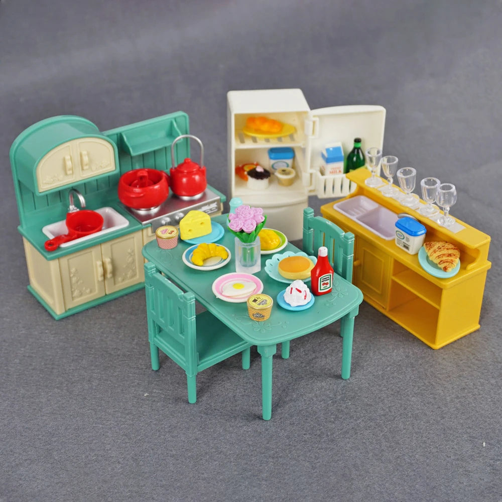 A 1:12 scale dollhouse furniture set featuring a kitchen with appliances, a dining table, and storage cabinets.