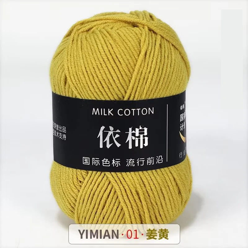 A ball of yellow milk cotton yarn labeled YIMIAN 01, ready for knitting or crochet.
