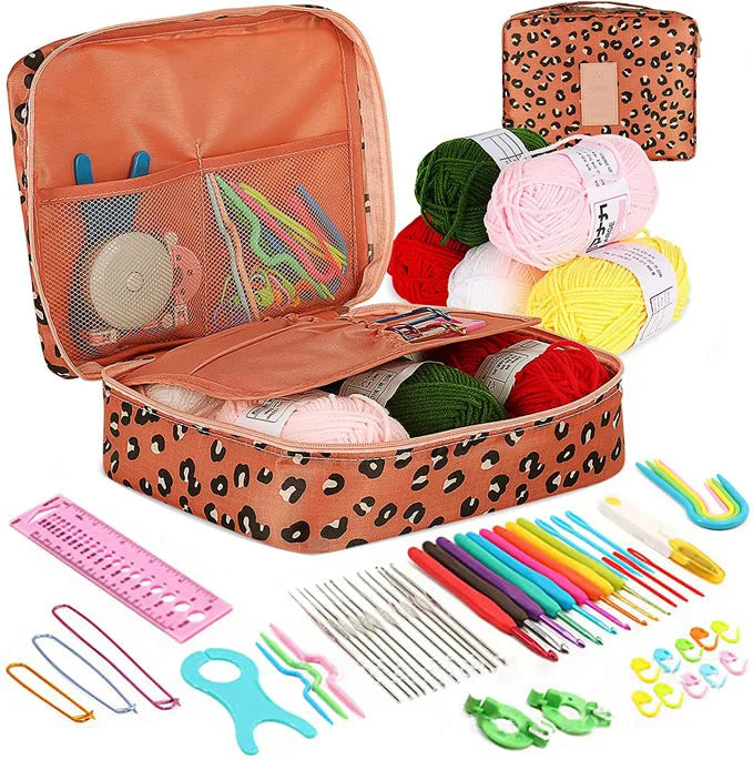 A collection of crochet and knitting tools including hooks needles and various colored yarn and accessories.