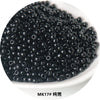 A pile of small, black electroplated metallic glass beads for jewelry and crafting.