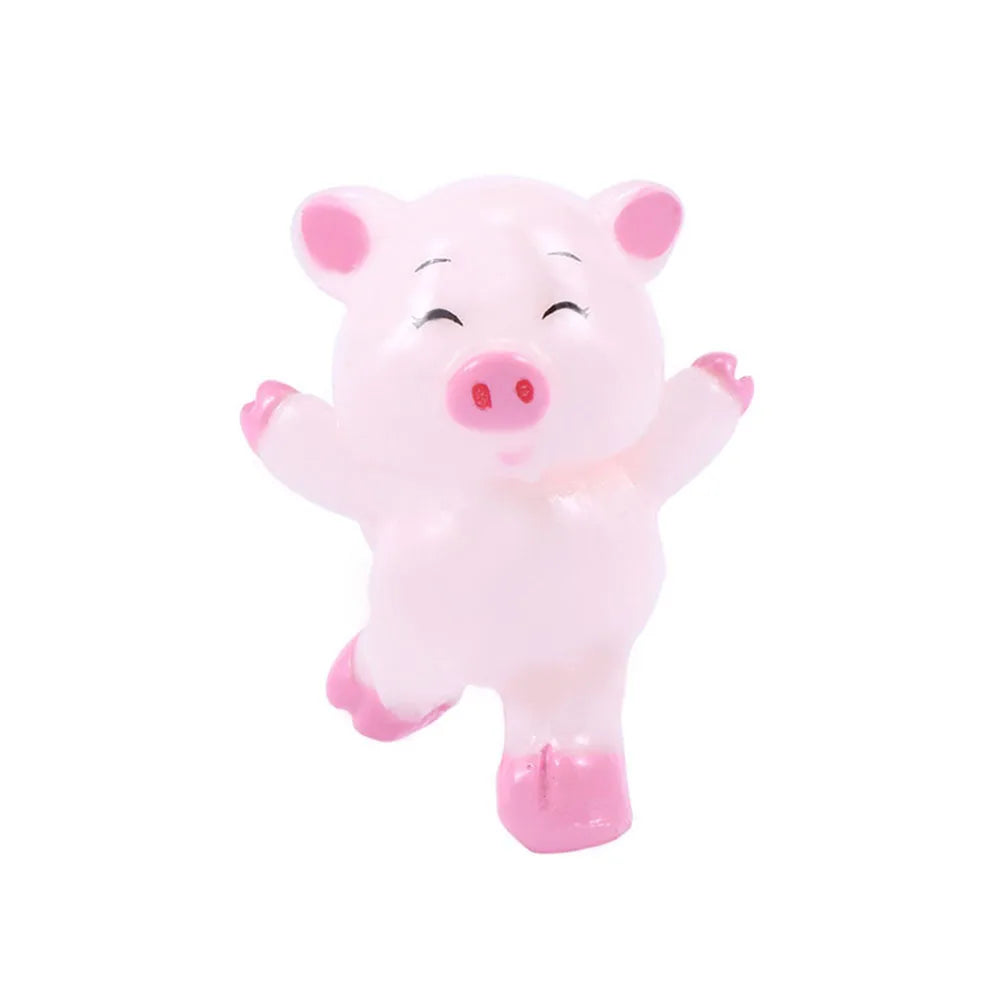 A pink ceramic pig figurine with a cute expression.