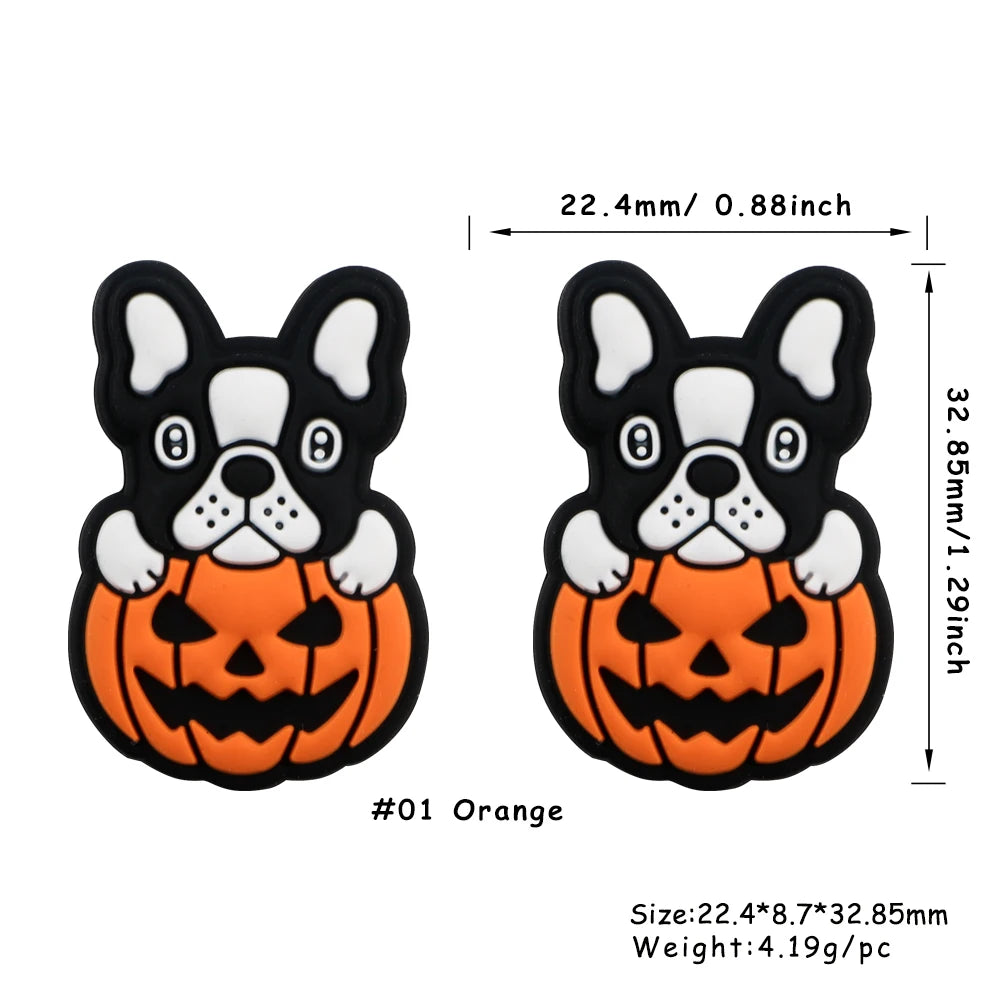 Orange silicone bead shaped like a black and white dog face for jewelry making